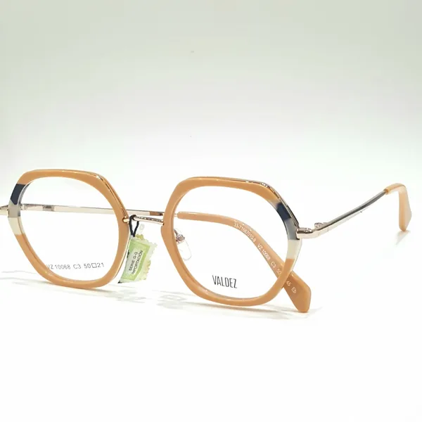 Armazón combinado en beige y metal dorado, disponible en el local