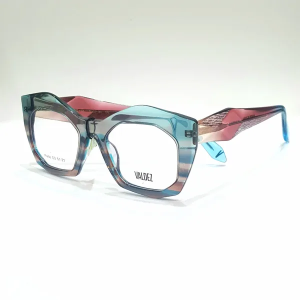 Armazón de acetato rayado en tonos rosa y verde, disponible en el local
